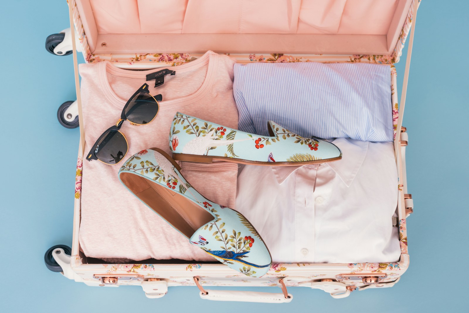 A suitcase and travel essentials ready for packing.